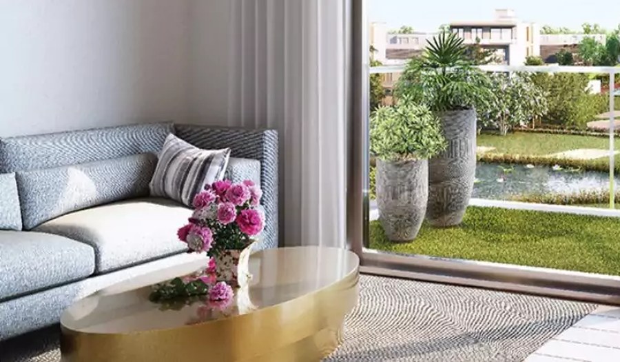 Soft seating and flowers by the sliding balcony door – L&T Realty Sector 86 Gurgaon