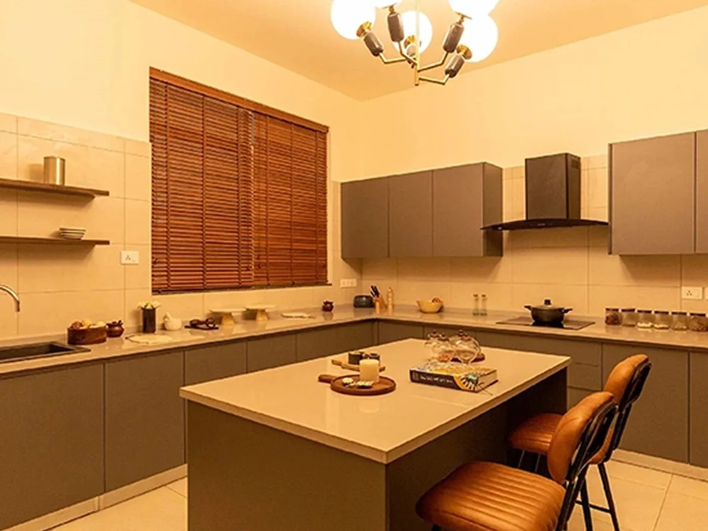 Modern modular kitchen with island in Prestige Sector 109 apartment